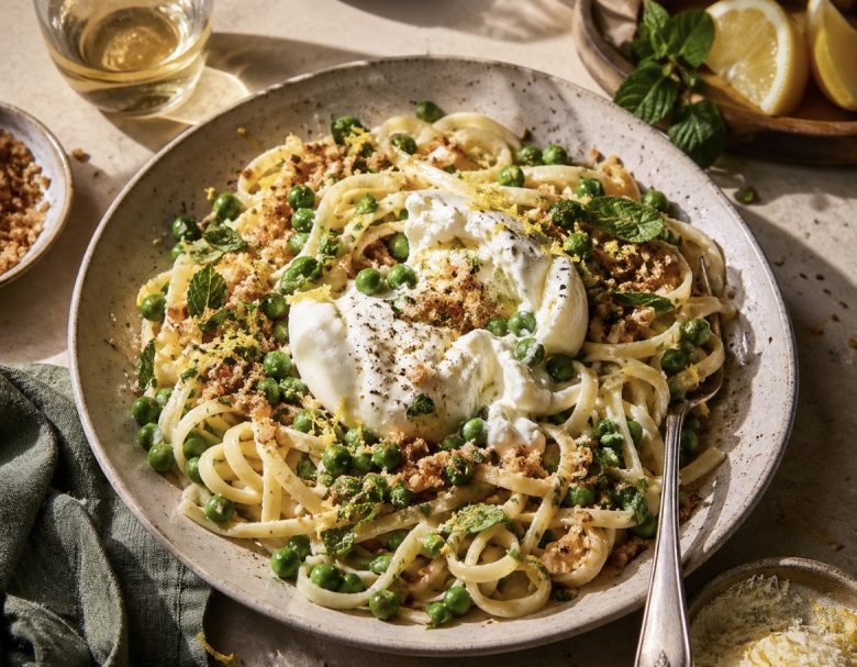 Spring Pea & Burrata Pasta with Toasted Breadcrumbs in a shallow bowl with torn burrata, lemon zest, and golden crumbs